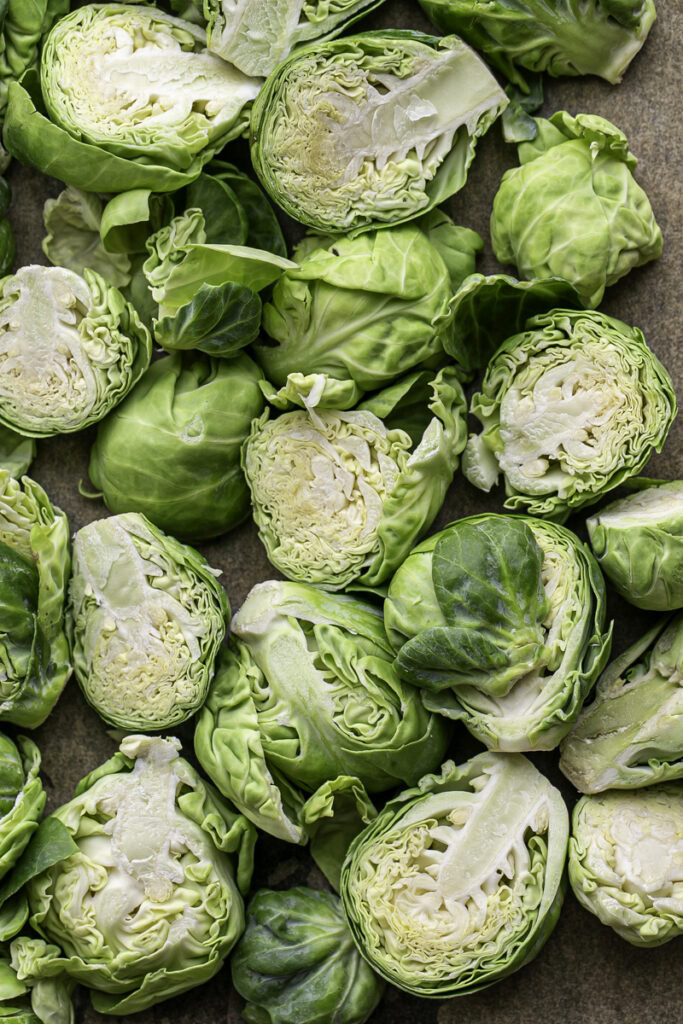 raw brussels sprouts sliced in half.