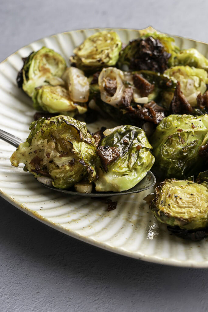 close up of brussels sprouts on a serving spoon.