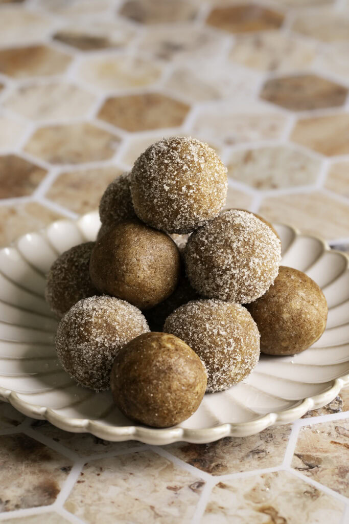 No-Bake Almond Flour Churro Bites stacked on top of one another.