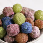 close up of sour patch grapes in a bowl.