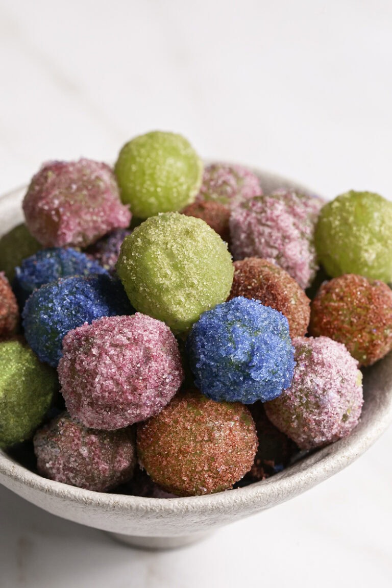 close up of sour patch grapes in a bowl.