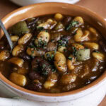 close up 3/4 shot of 3 Bean Stovetop Baked Beans.