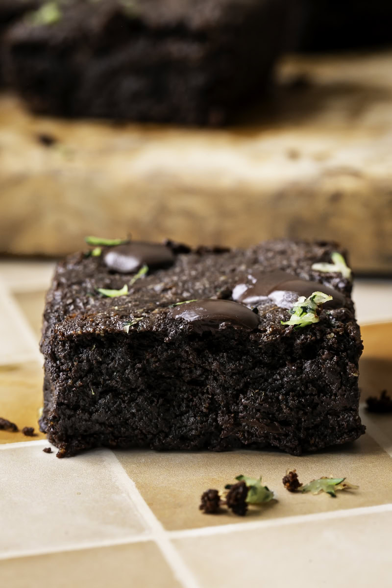 a close up of a single Almond Flour Zucchini Tahini Brownie.