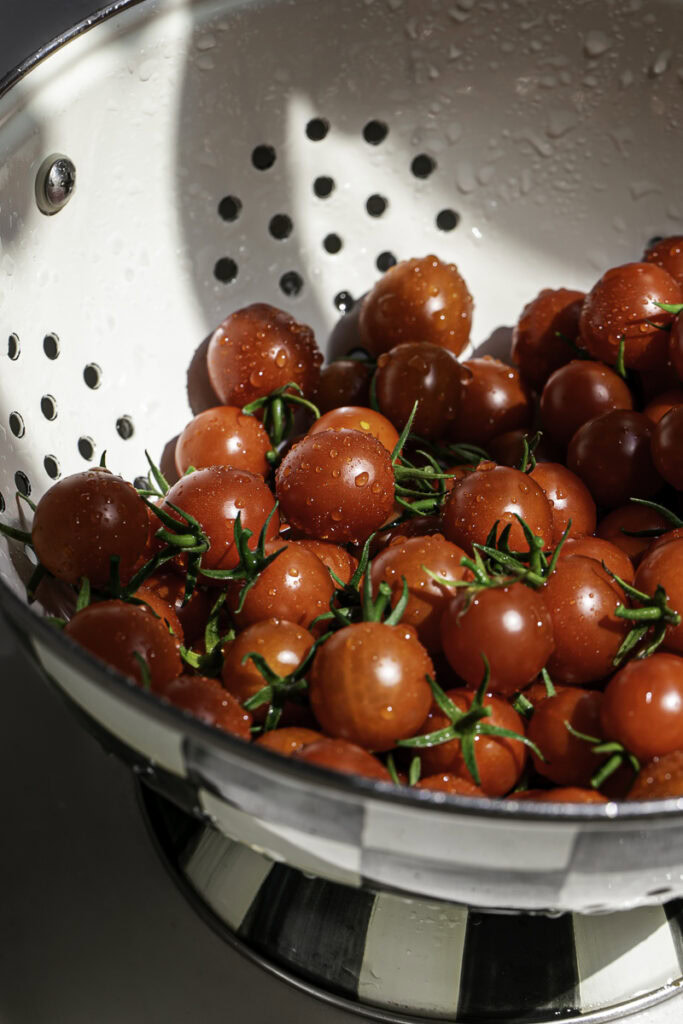 freshly picked cherry tomatoes in a colander.