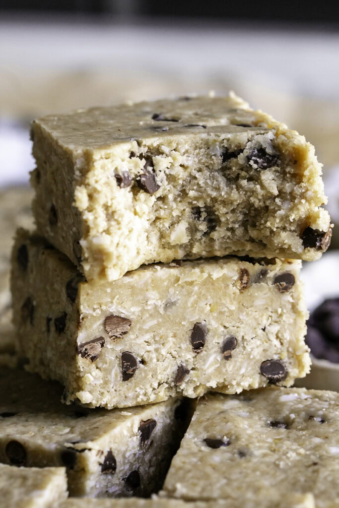 two Oatmeal Chocolate Chip Heavenly Hunks stacked on top of one another, the top one with a bite taken out of it.