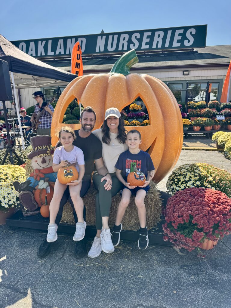 family photo at the pumpkin farm.