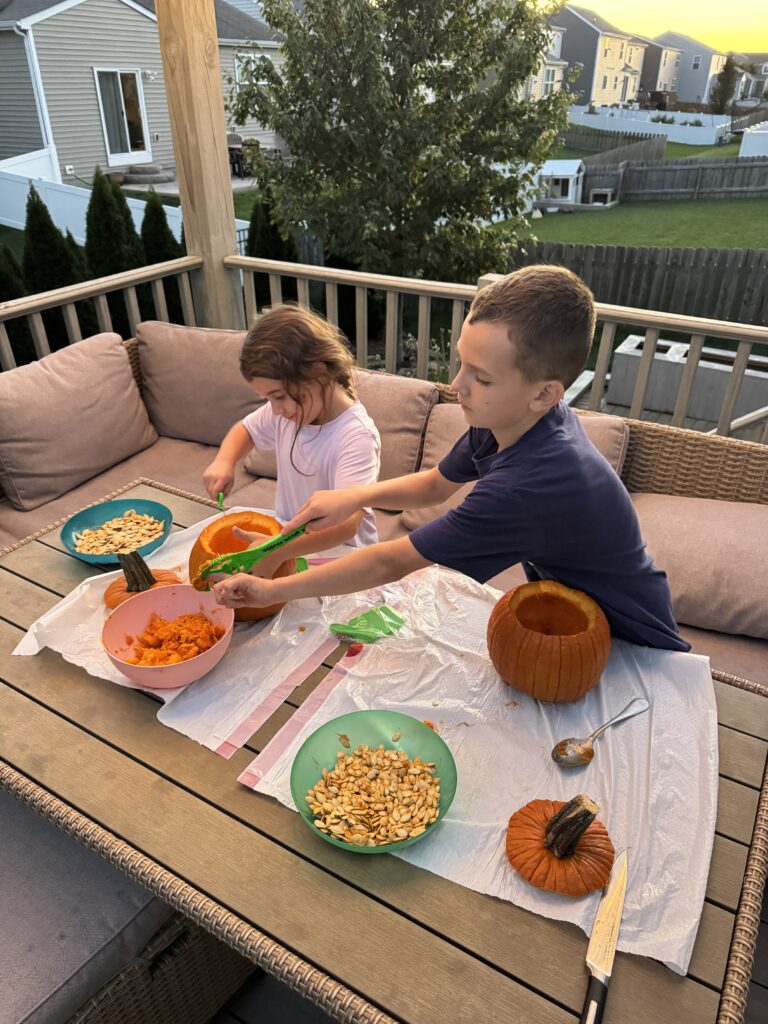 kids carving pumpkins.