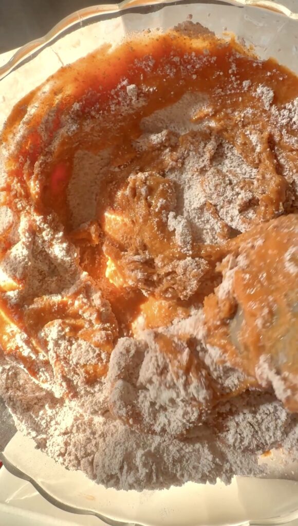 stirring the dry and wet cake ingredients together.