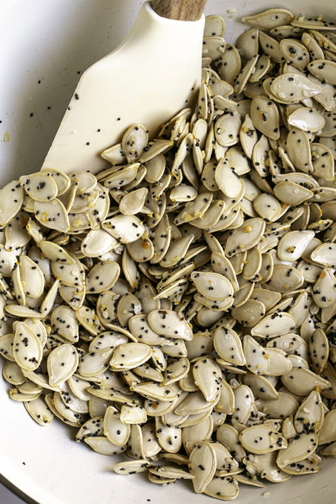 all of the raw pumpkin seeds coated with the vegan butter and everything bagel seasoning.