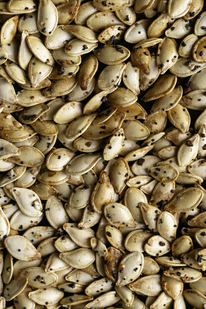 roasted everything bagel pumpkin seeds on a baking sheet.