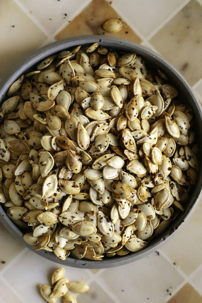 overhead shot of everything bagel roasted pumpkin seeds in a bowl.