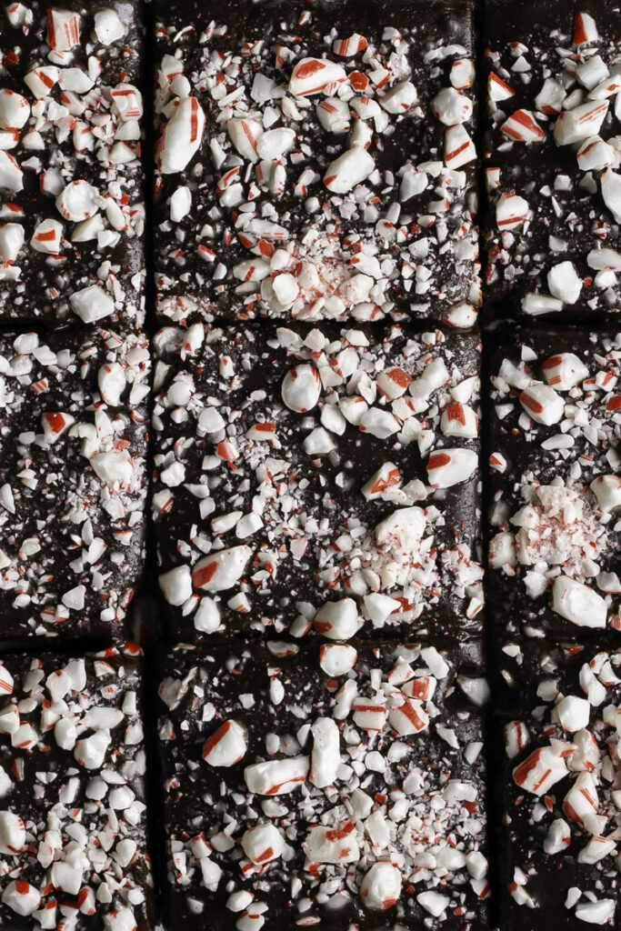 overhead image of Fudgy Flourless Peppermint Date Brownies sliced but still together in a square.