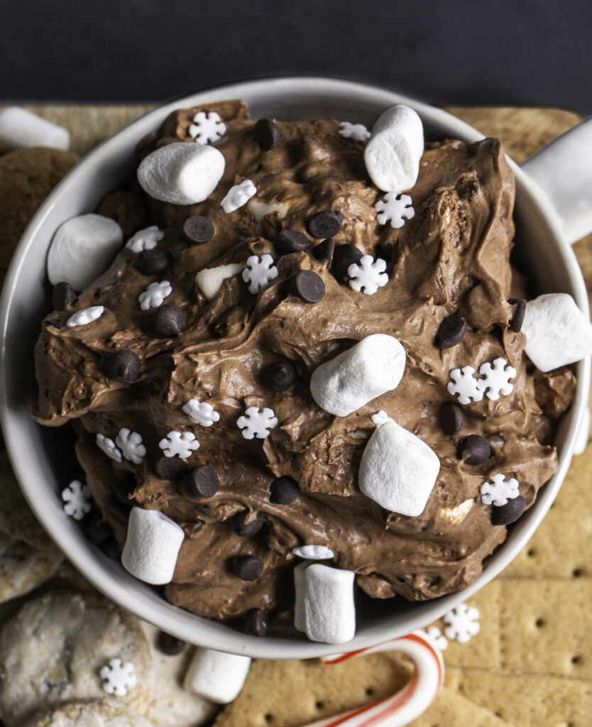 very close up of creamy vegan hot cocoa dip in a mug.