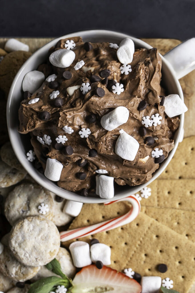 overhead close up shot of creamy vegan hot cocoa dip in a mug.