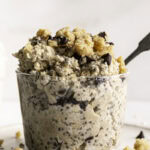 close up shot of glasses of chocolate chip cookie dough overnight oats, one with a spoon in it.