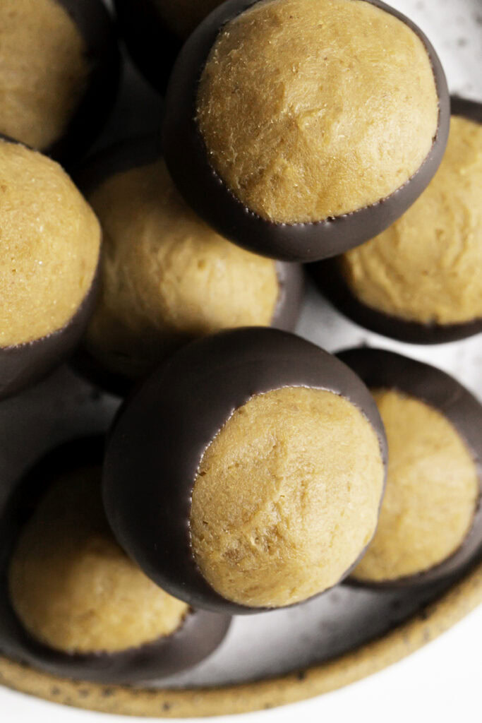 close up overhead shot of vegan buckeyes on a plate.
