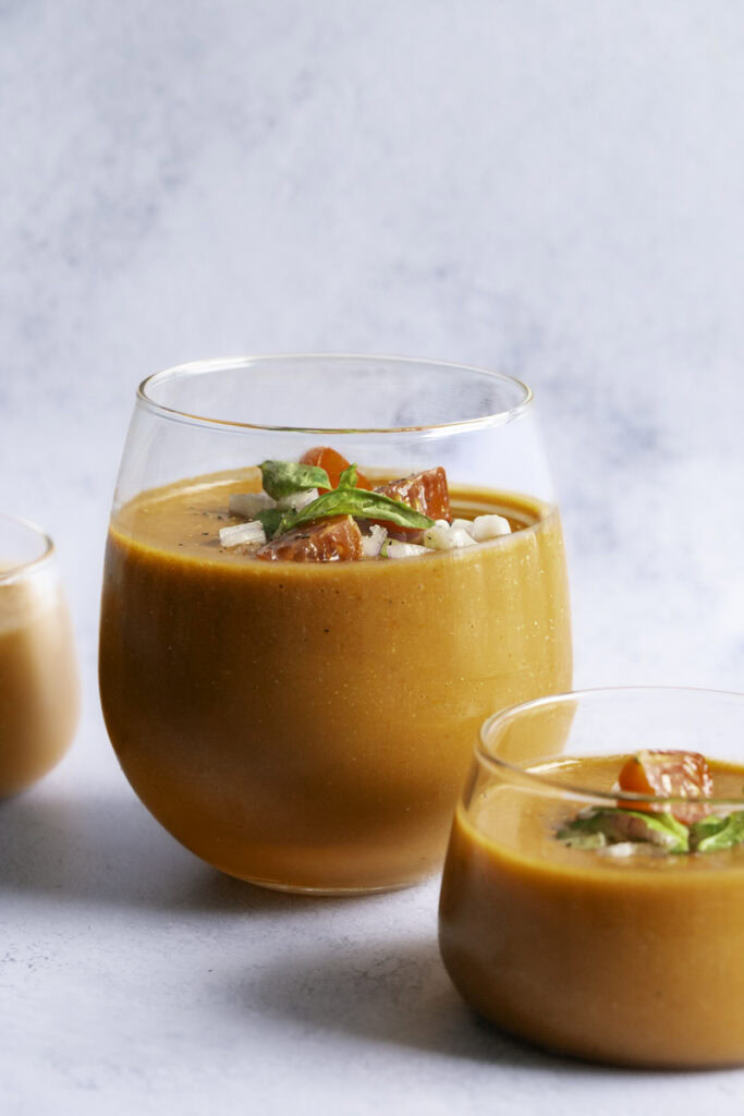 glasses filled with cherry tomato gazpacho.