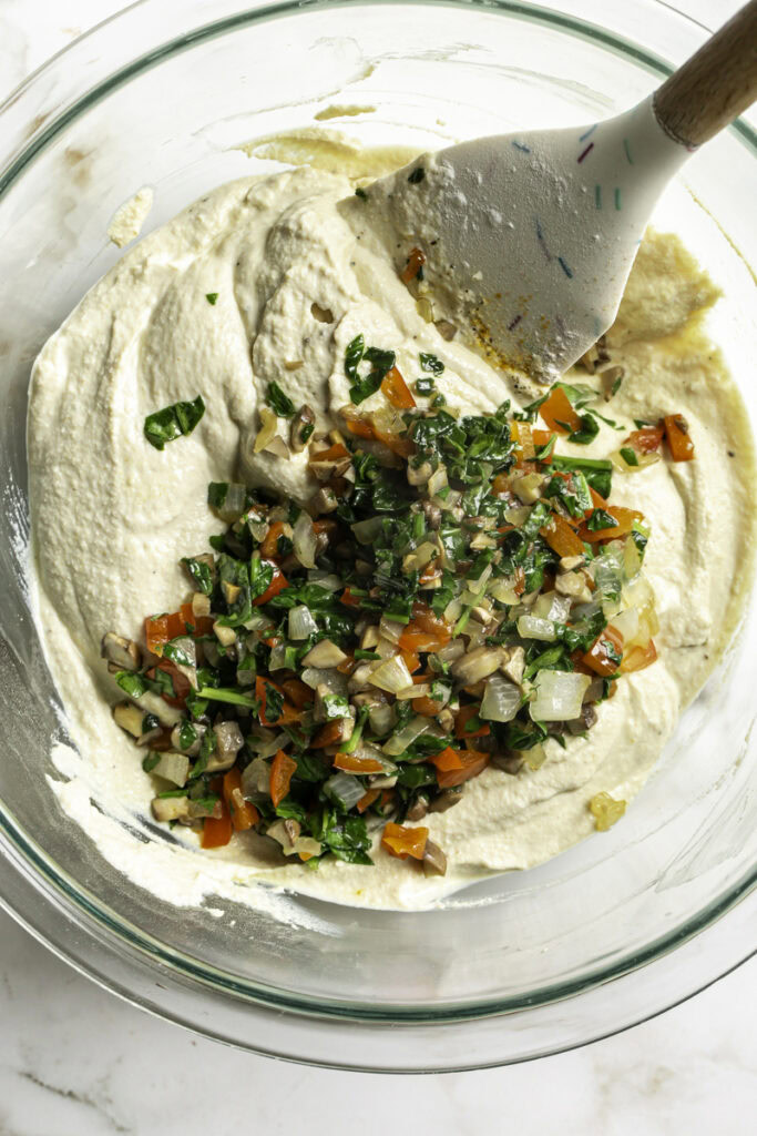 the sauteed veggies in the bowl with the tofu "egg" mixture.