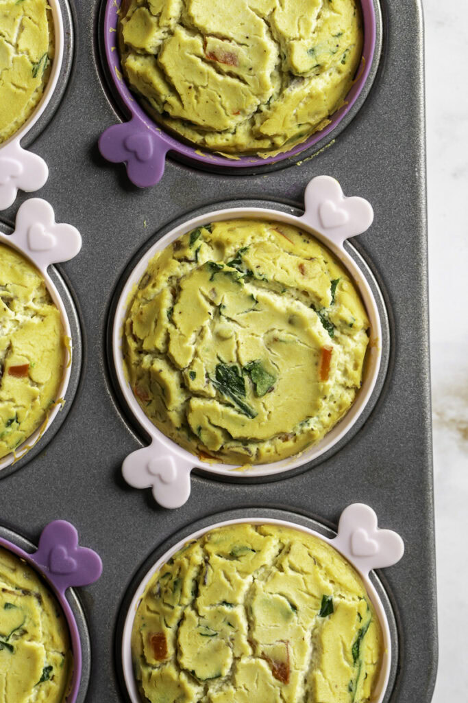 vegan baked spinach mushroom pepper onion egg bites baked still in the muffin tin.