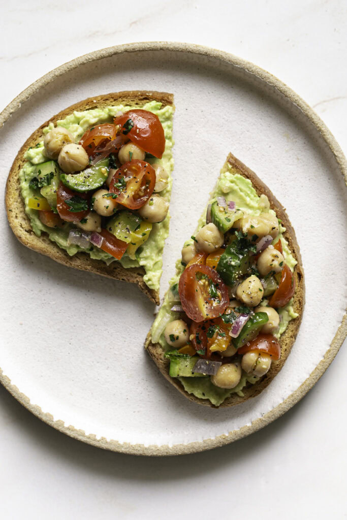 chickpea salad served on top of avocado toast.