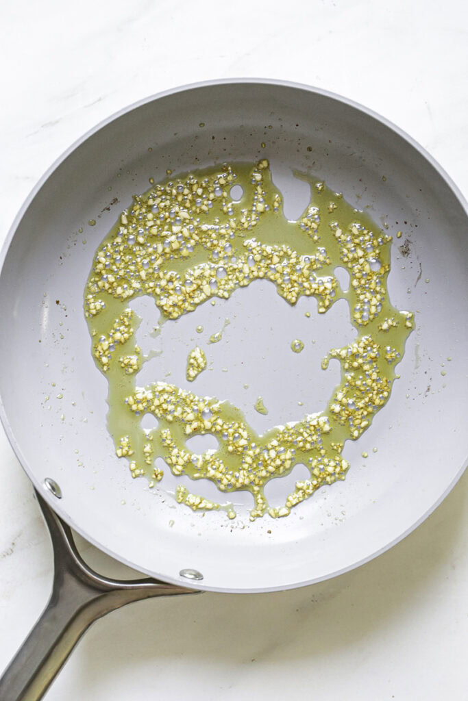 sauteed minced garlic in olive oil in a skillet.