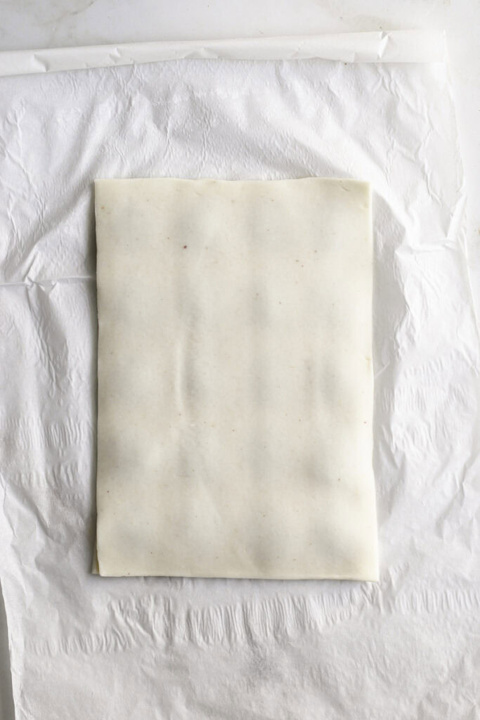 a second pie dough rectangle placed on top of the strawberry chia jam.