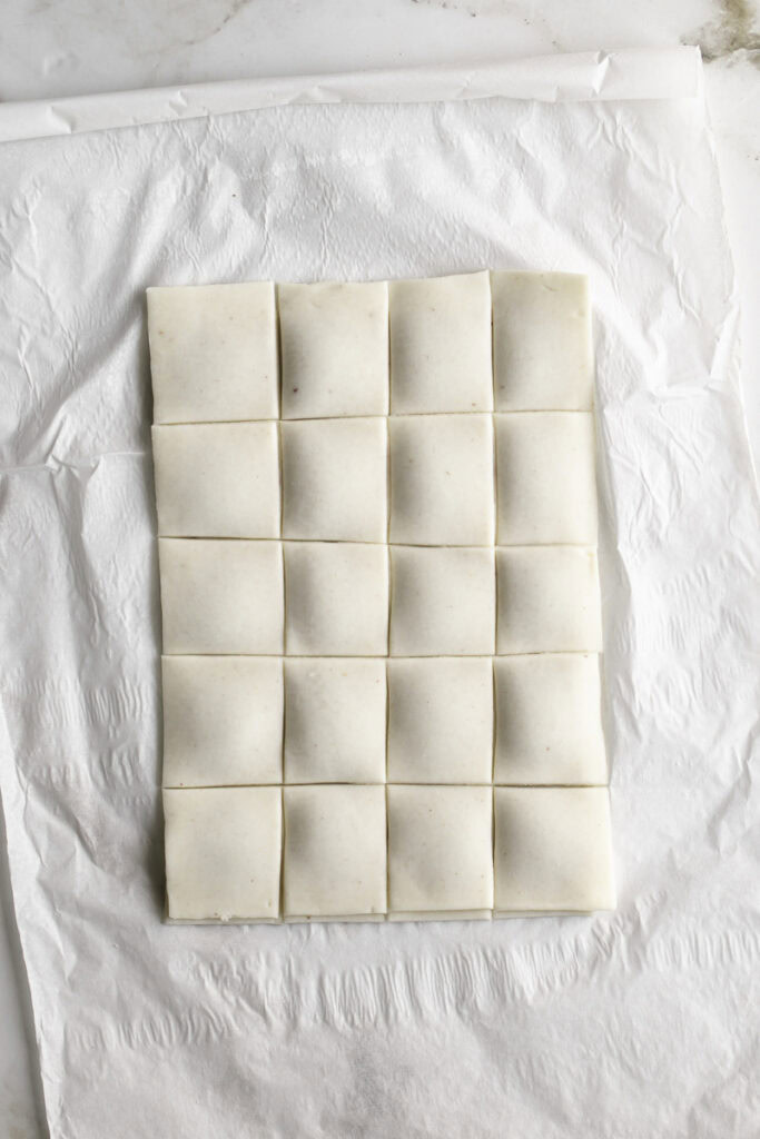 large pie dough rectangles sliced into smaller rectangles.