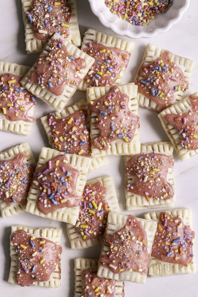mini strawberry chia pop tarts piled on top of one another.