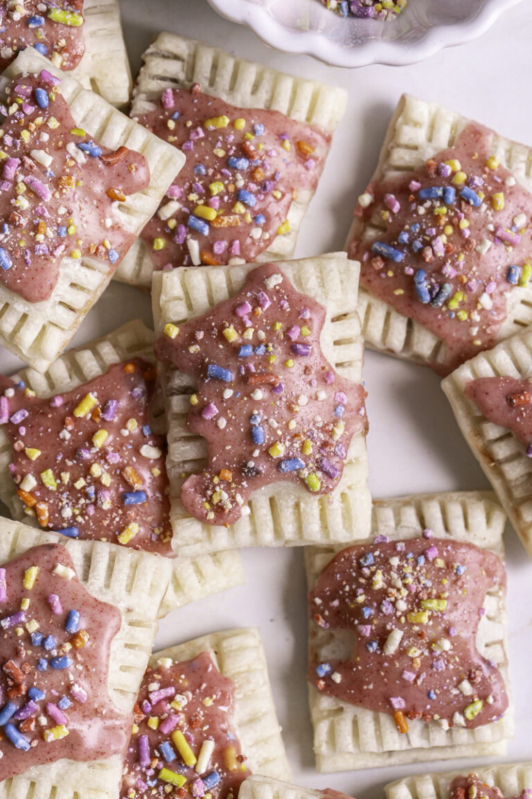 mini strawberry chia pop tarts piled on top of one another.