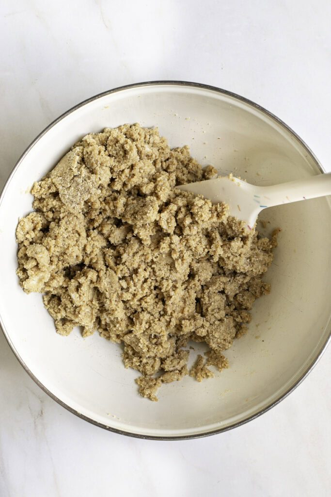 cinnamon cookie dough in a bowl with a spatula.