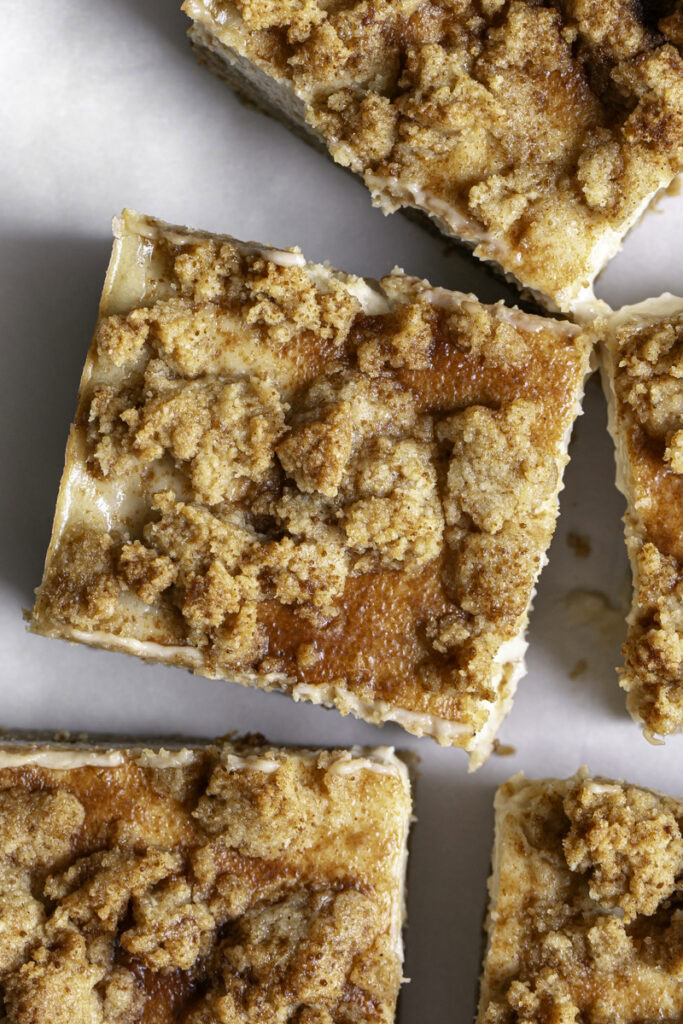overhead shot of sliced Cinnamon Cookie Cheesecake Crumb Bars