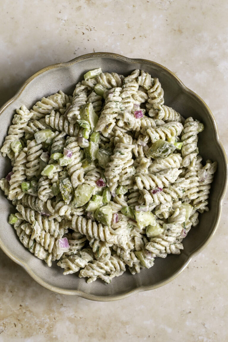a close up overhead shot of a bowl of dill pickle pasta salad.