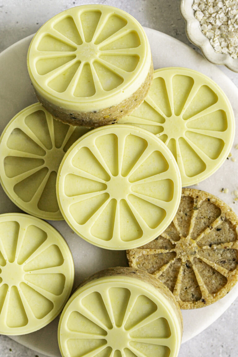 Lemon White Chocolate Hemp Quinoa Cookies overlapping on a marble plate.