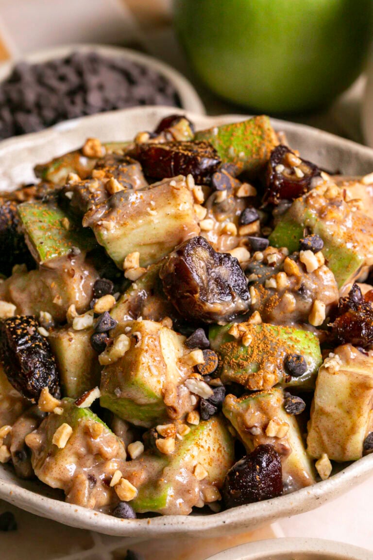 close up 3/4 image of caramel apple date salad in a bowl.