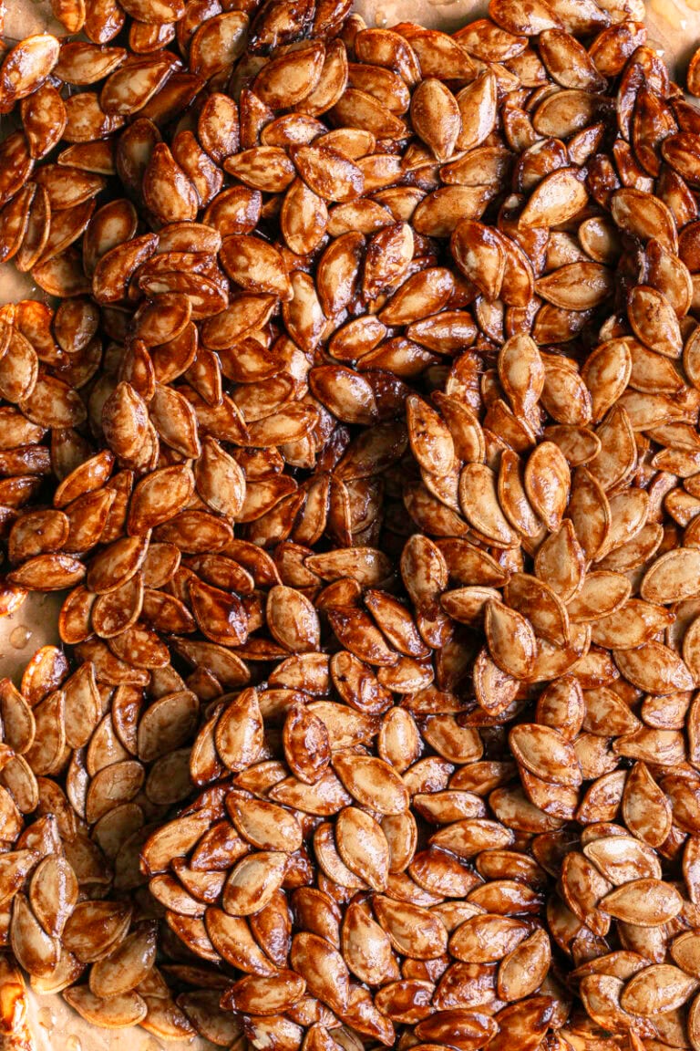 close up shot of Maple Cinnamon Sugar Pumpkin Seed Brittle broken into large pieces.