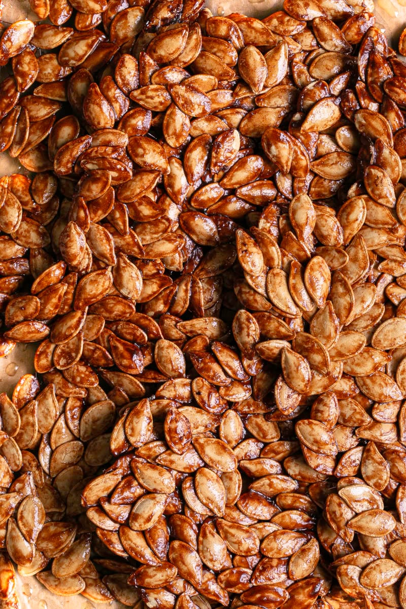 close up shot of Maple Cinnamon Sugar Pumpkin Seed Brittle broken into large pieces.
